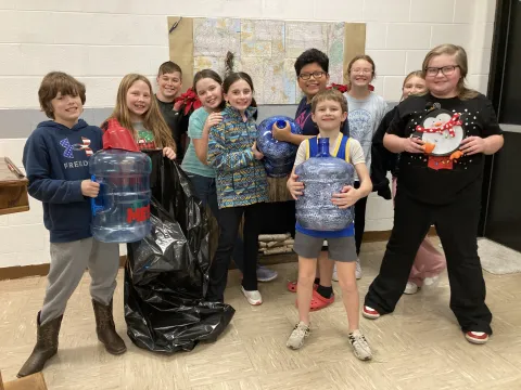 4H officers at Maynardville Elementary with the pop top tabs they have collected.