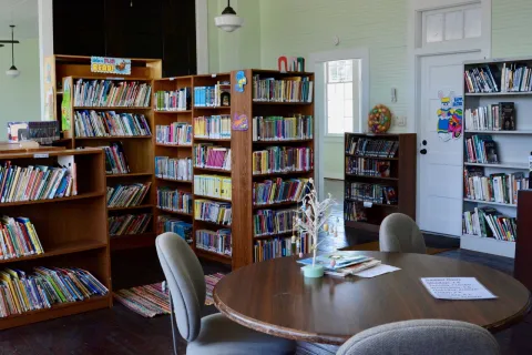 The book station side of Historic Oak Grove School features a children's reading nook.