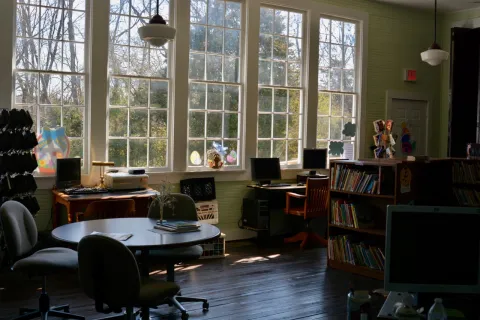 The original windows of Oak Grove School bring plenty of natural light into the book station.