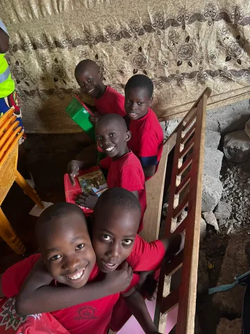 Amie Winstead,  Area Coordinator for the project, traveled to Nairobi, Kenya, this summer.  This photo was taken after a distribution event where children received shoeboxes and heard of Jesus' love for them...some for the very first time.