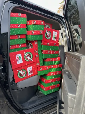 Karen Walker delivers a fully-loaded vehicle with shoeboxes packed by First Baptist Church of Maynardville. 