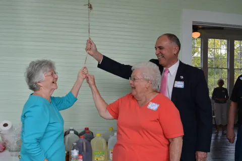  Former Oak Grove School teachers Ester Webb and Georgia Cole ring the school bell with help from Union County Mayor Mike Williams.