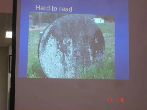 A tombstone aged by the elements.