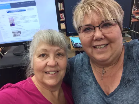 Sharps Chapel Book Station attendant Sherry Medina meets with Maynardville Public Library director Chantay Collins for a workshop on new library technology.