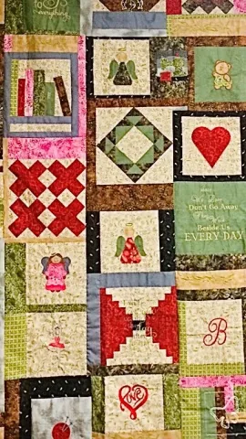 Quilt with various shapes on a patchwork design