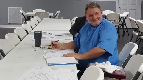 Man listening at a meeting