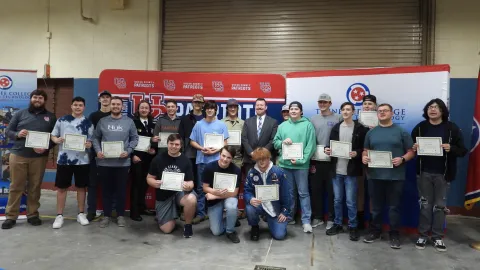 Student group holding certificates