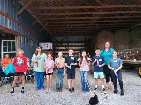 Chick Chain winners. Left to right- Asher Effler, Ariona Payne, Dixie Ray, Jude Firkin, Jepson Haynes, Presley Lay, Zyon Copeland, Sarah Stokely-Cook (4-H Agent), and Cooper Bowman. 