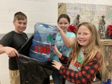 Maynardville Elementary 4H Community Service officers emptying their pop top tabs for the Ronald McDonald House Charities.