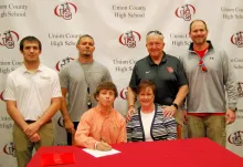 Pictured, seated L-R: Dalton Truan, Cathy Norris, aunt; standing L-R: Cumberlands head wrestling coach Travis Barroquillo, UCHS head wrestling coach James Ramirez, UCHS head football coach Larry Kerr and UCHS assistant football coach Josh Kerr.