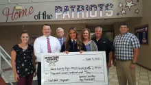 Representatives of Tennessee Farm Bureau, Tennessee Coop, and Farm Credit Mid-America award a donation to Union County FFA