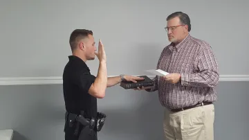 Mayor installs a police qfficer