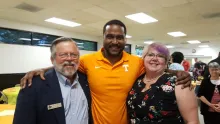 BPA President Martin Shafer, Sterling Benton, Chantay Collins celebrate with a group hug.